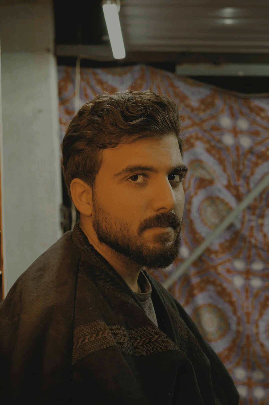 Portrait of a bearded man looking at the camera