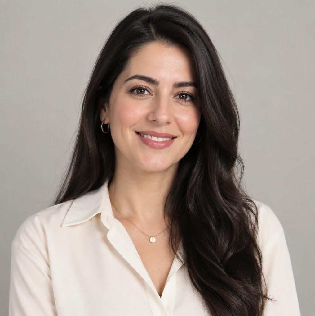 Portrait of a Turkish woman with dark hair smiling